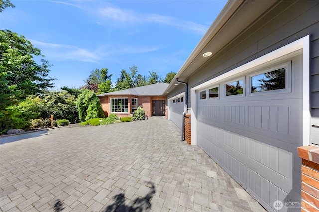 2620 Birch St, Bellingham, WA 98226 - view of property exterior with decorative driveway and an attached garage