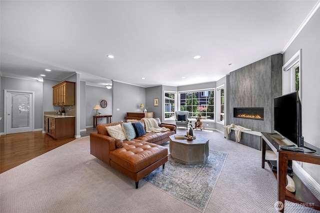 2620 Birch St, Bellingham, WA 98226 - living room with recessed lighting, a fireplace, crown molding, and carpet