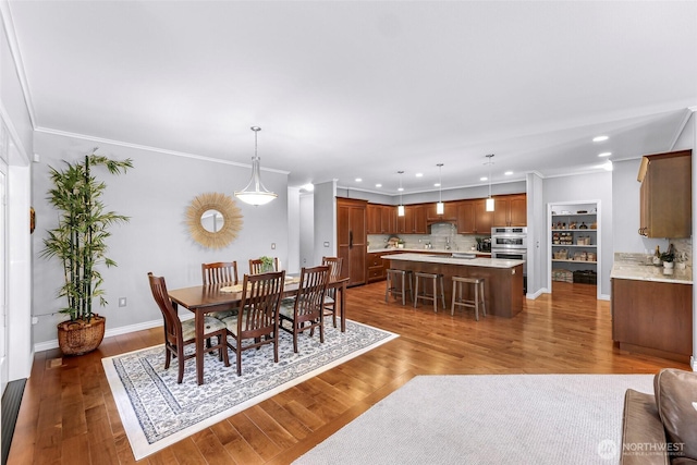 2620 Birch St, Bellingham, WA 98226 - dining space featuring recessed lighting, crown molding, and wood finished floors