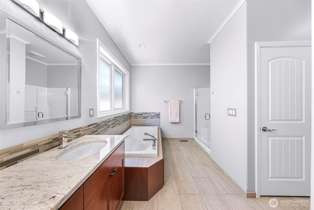 2620 Birch St, Bellingham, WA 98226 - bathroom with a shower stall, vanity, crown molding, and a garden tub