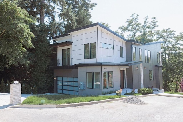 14737 56th Ave S, Tukwila, WA 98168 - modern home with an attached garage and a balcony