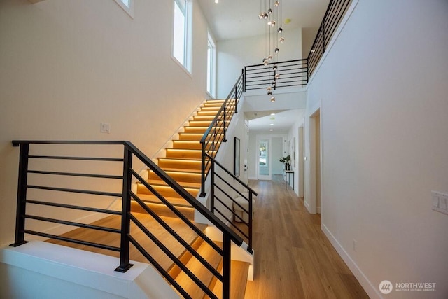 14737 56th Ave S, Tukwila, WA 98168 - staircase with a towering ceiling and wood finished floors