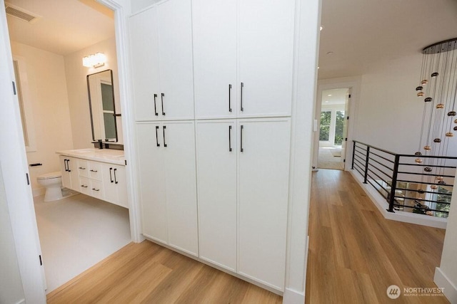 14737 56th Ave S, Tukwila, WA 98168 - hallway featuring light wood-style floors