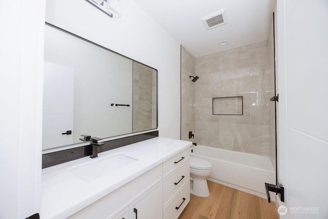 14737 56th Ave S, Tukwila, WA 98168 - full bath featuring vanity, wood finished floors, and bathtub / shower combination