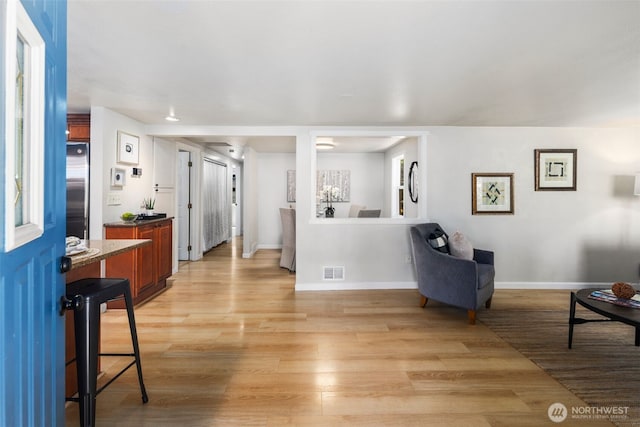 11432 11th Ave SW, Seattle, WA 98146 - living room featuring light wood-style floors and baseboards