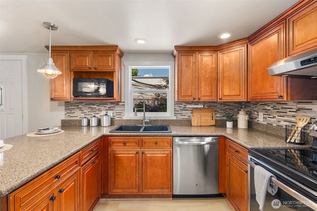 11432 11th Ave SW, Seattle, WA 98146 - kitchen featuring stainless steel appliances, under cabinet range hood, and brown cabinets