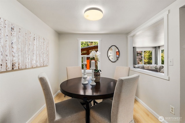 11432 11th Ave SW, Seattle, WA 98146 - dining area with light wood-style floors and plenty of natural light