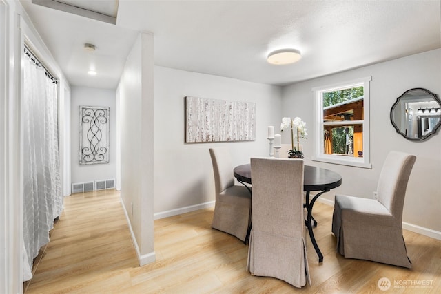11432 11th Ave SW, Seattle, WA 98146 - dining room with light wood-style flooring and baseboards