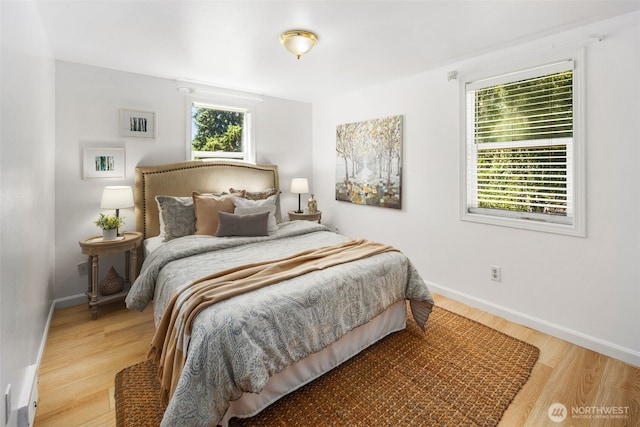 11432 11th Ave SW, Seattle, WA 98146 - bedroom featuring light wood-style flooring and baseboards