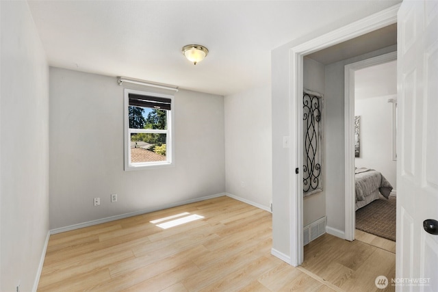 11432 11th Ave SW, Seattle, WA 98146 - unfurnished room featuring wood finished floors and baseboards