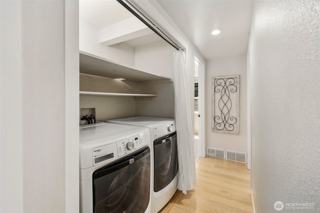 11432 11th Ave SW, Seattle, WA 98146 - laundry area with washing machine and dryer, light wood-type flooring, and recessed lighting