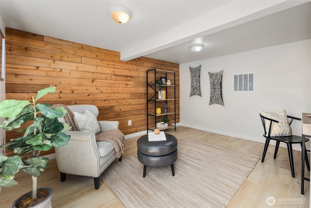11432 11th Ave SW, Seattle, WA 98146 - sitting room featuring wooden walls, wood finished floors, and beam ceiling