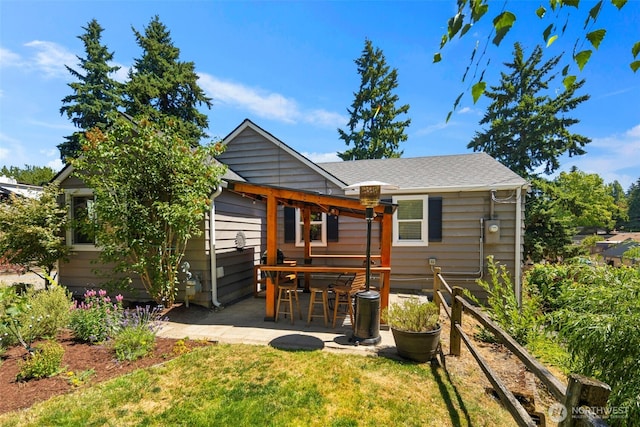 11432 11th Ave SW, Seattle, WA 98146 - back of property featuring a patio and a lawn