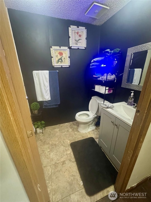 7619 156th Street Ct E Unit 9, Puyallup, WA 98375 - bathroom with a textured ceiling and vanity