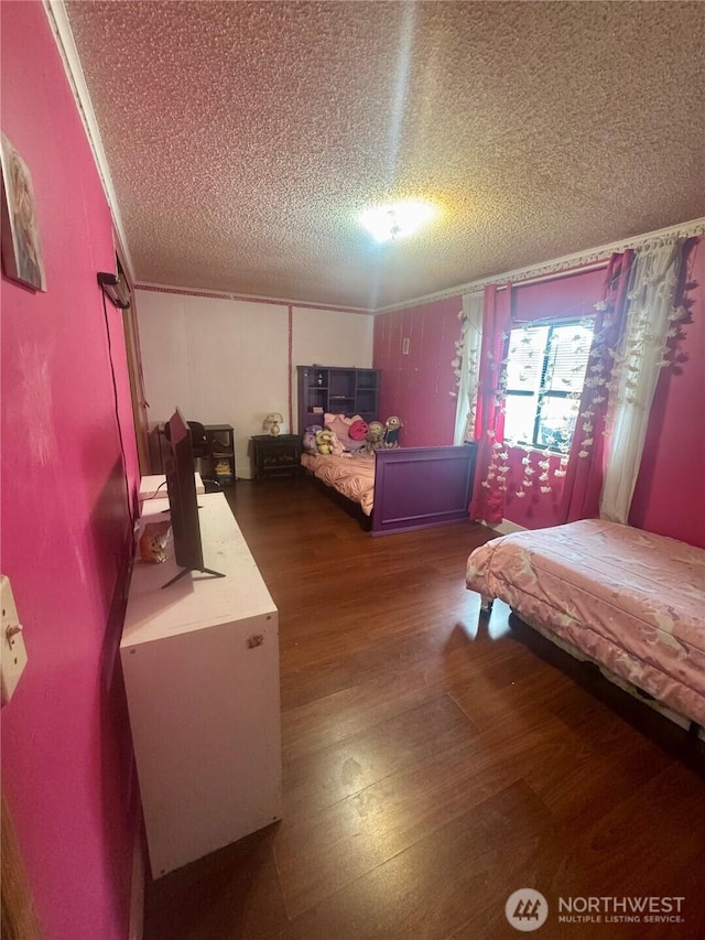 7619 156th Street Ct E Unit 9, Puyallup, WA 98375 - bedroom with a textured ceiling, wood finished floors, and crown molding