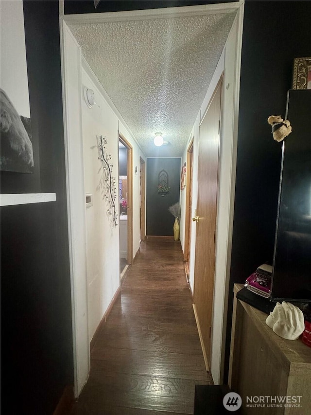 7619 156th Street Ct E Unit 9, Puyallup, WA 98375 - hallway featuring a textured ceiling and wood finished floors