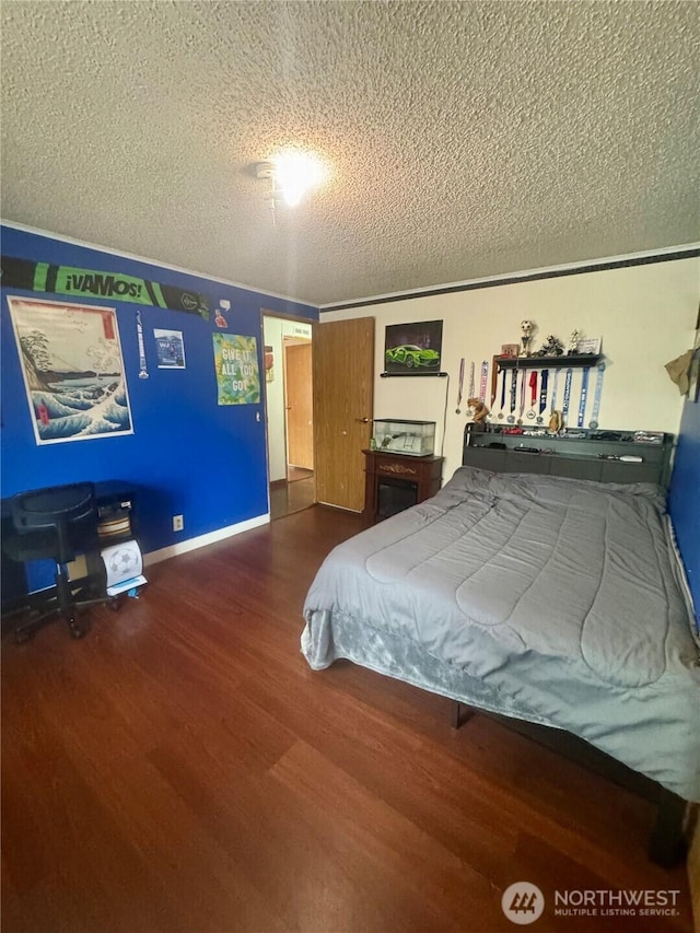 7619 156th Street Ct E Unit 9, Puyallup, WA 98375 - bedroom with a textured ceiling and wood finished floors
