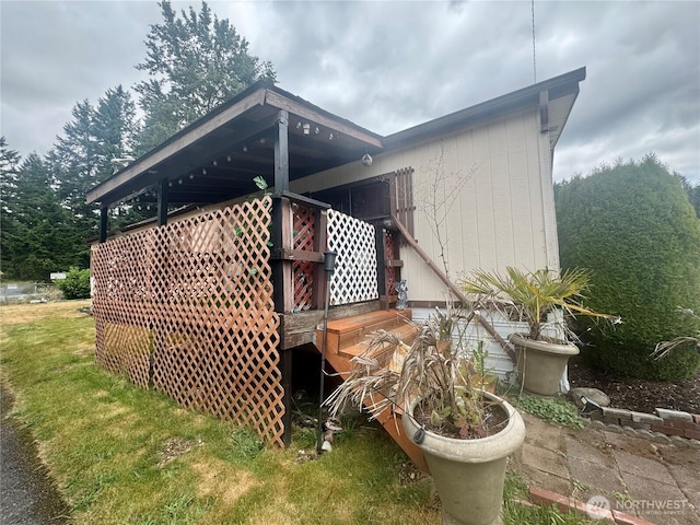 7619 156th Street Ct E Unit 9, Puyallup, WA 98375 - rear view of house with a lawn