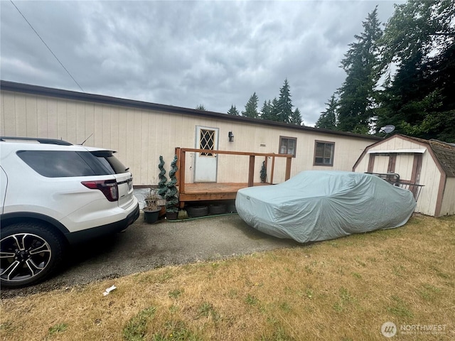 7619 156th Street Ct E Unit 9, Puyallup, WA 98375 - back of property featuring a storage shed and a yard