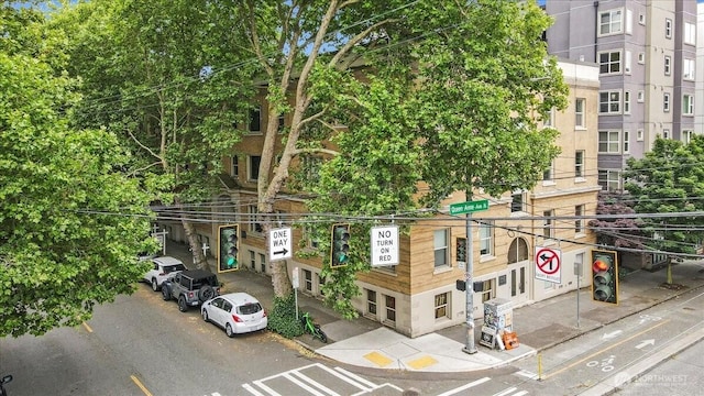 7 Harrison St Unit 5, Seattle, WA 98109 - view of property featuring uncovered parking