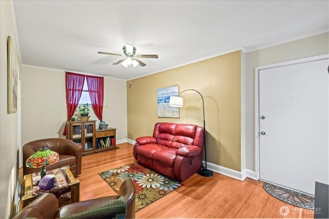 7 Harrison St Unit 5, Seattle, WA 98109 - living room featuring wood-type flooring, ornamental molding, and ceiling fan