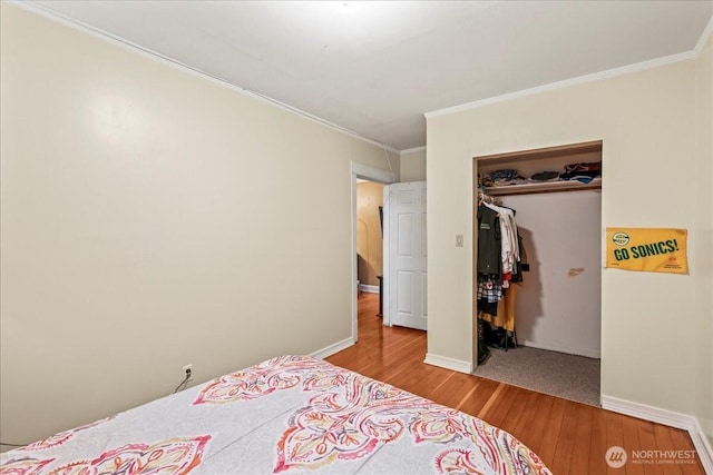 7 Harrison St Unit 5, Seattle, WA 98109 - bedroom featuring hardwood / wood-style flooring, ornamental molding, and a closet
