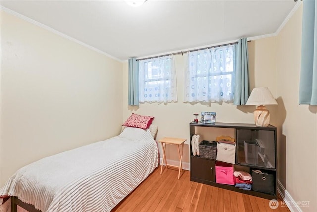 7 Harrison St Unit 5, Seattle, WA 98109 - bedroom with hardwood / wood-style flooring, multiple windows, and ornamental molding