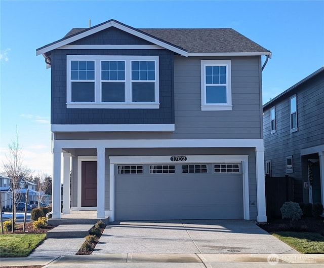 224 18th Dr Unit 96, Snohomish, WA 98290 - view of front of home with an attached garage, concrete driveway, and a shingled roof