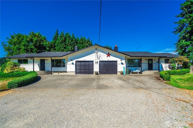 11613 63rd Street Ct E, Puyallup, WA 98372 - ranch-style home featuring an attached garage, driveway, and a chimney