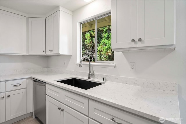 11613 63rd Street Ct E, Puyallup, WA 98372 - kitchen with stainless steel dishwasher, white cabinets, and light stone countertops
