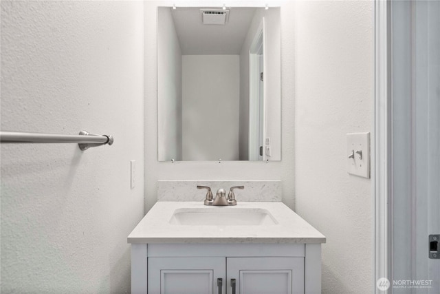 11613 63rd Street Ct E, Puyallup, WA 98372 - bathroom featuring vanity and a textured wall