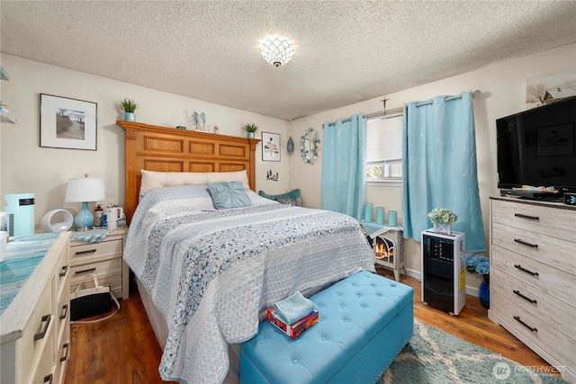 11613 63rd Street Ct E, Puyallup, WA 98372 - bedroom featuring a textured ceiling and wood finished floors