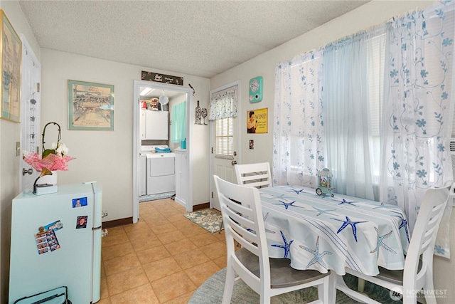 11613 63rd Street Ct E, Puyallup, WA 98372 - dining room with washer and dryer and a textured ceiling