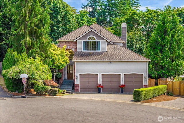 30449 103rd Ct SE, Auburn, WA 98092 - view of front facade featuring a chimney, brick siding, and driveway