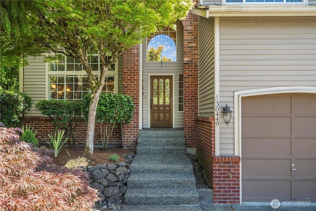 30449 103rd Ct SE, Auburn, WA 98092 - view of exterior entry with a garage and brick siding