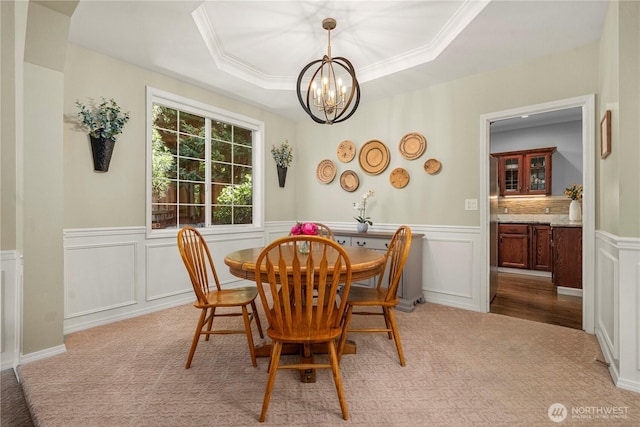 30449 103rd Ct SE, Auburn, WA 98092 - dining room with a chandelier, light colored carpet, a decorative wall, a wainscoted wall, and a raised ceiling
