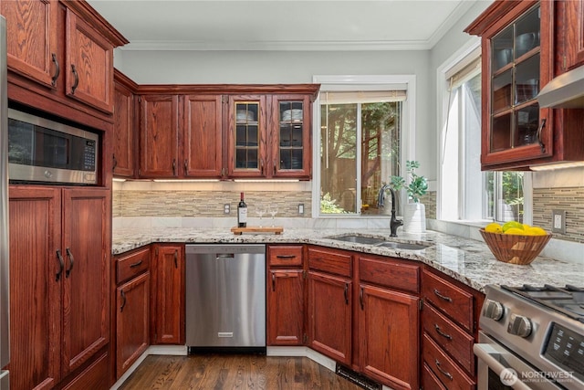 30449 103rd Ct SE, Auburn, WA 98092 - kitchen with stainless steel appliances, plenty of natural light, tasteful backsplash, light stone countertops, and ornamental molding