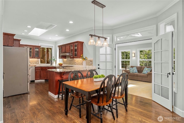 30449 103rd Ct SE, Auburn, WA 98092 - dining space featuring a skylight, crown molding, dark wood finished floors, and recessed lighting