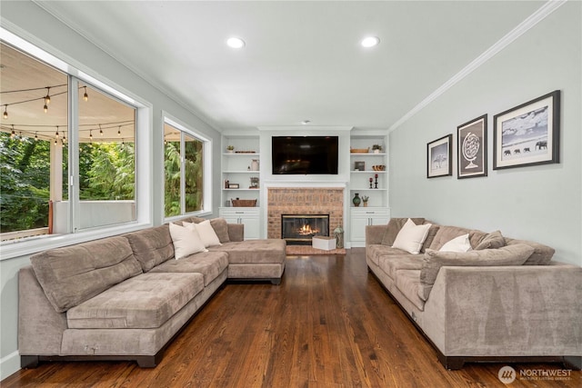 30449 103rd Ct SE, Auburn, WA 98092 - living room featuring crown molding, dark wood-style flooring, a brick fireplace, recessed lighting, and built in shelves