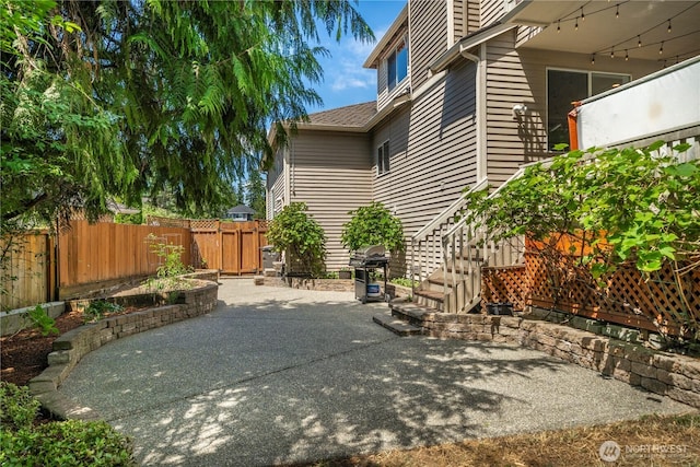 30449 103rd Ct SE, Auburn, WA 98092 - fenced backyard with a patio area and stairs