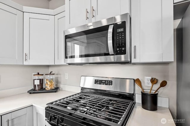 214 18th Dr Unit 100, Snohomish, WA 98290 - kitchen featuring appliances with stainless steel finishes, white cabinets, and light countertops