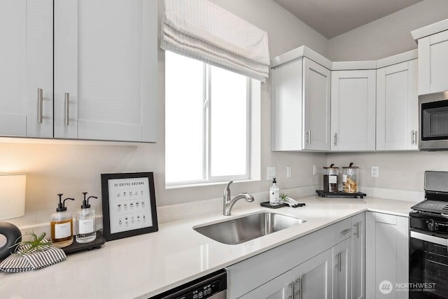 214 18th Dr Unit 100, Snohomish, WA 98290 - kitchen featuring range, stainless steel microwave, light countertops, and white cabinetry