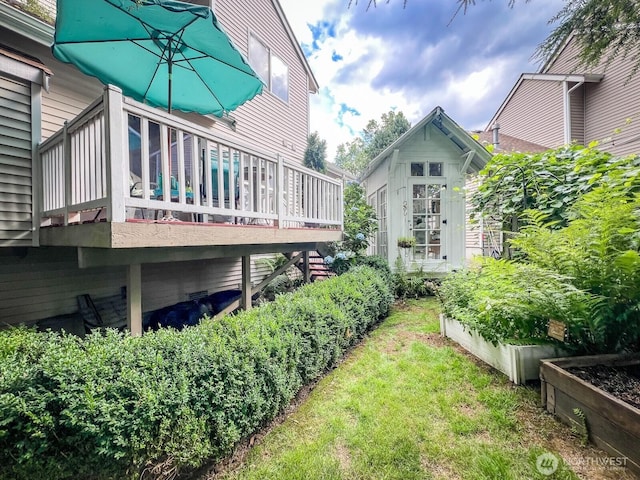 38774 SE Beta, Unit Snoqualmie, WA 98065 - view of green lawn featuring a vegetable garden and a deck