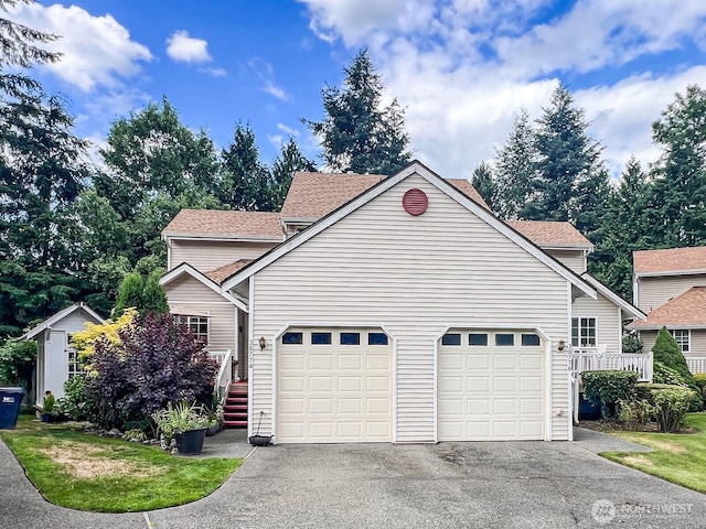 38774 SE Beta, Unit Snoqualmie, WA 98065 - view of property exterior with a garage, asphalt driveway, and a shingled roof