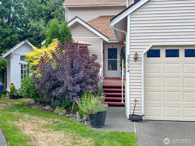 38774 SE Beta, Unit Snoqualmie, WA 98065 - view of exterior entry with roof with shingles and an attached garage