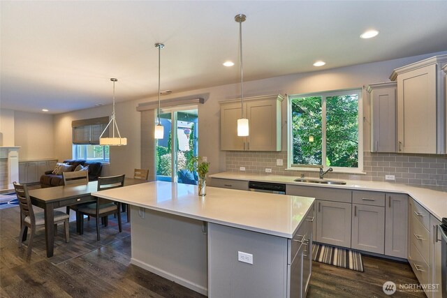 12235 SE 253rd St, Kent, WA 98030 - kitchen featuring gray cabinets, dark wood-type flooring, light countertops, decorative backsplash, and recessed lighting