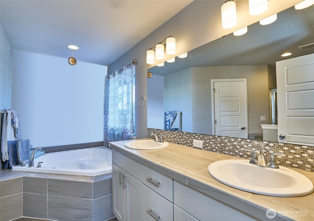 12235 SE 253rd St, Kent, WA 98030 - bathroom with double vanity, a garden tub, and tasteful backsplash