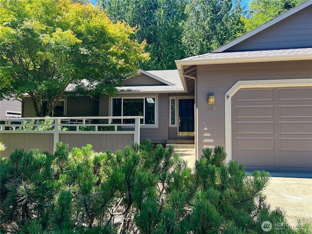 104 Puget Loop, Port Ludlow, WA 98365 - view of front of home with roof with shingles and an attached garage