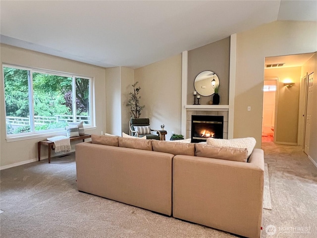 104 Puget Loop, Port Ludlow, WA 98365 - carpeted living area featuring a fireplace and lofted ceiling