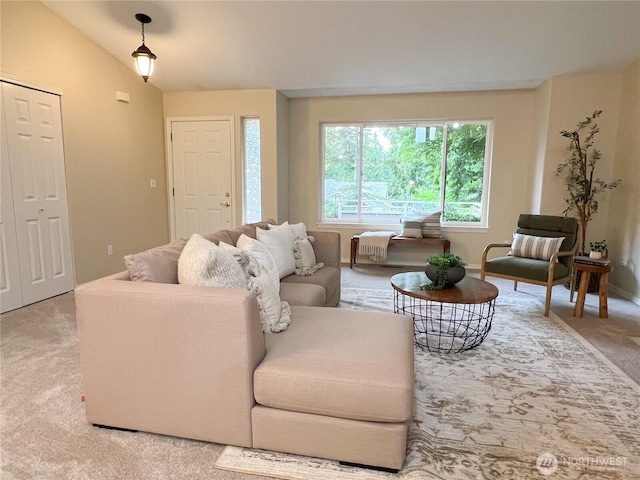 104 Puget Loop, Port Ludlow, WA 98365 - living room featuring light colored carpet and lofted ceiling